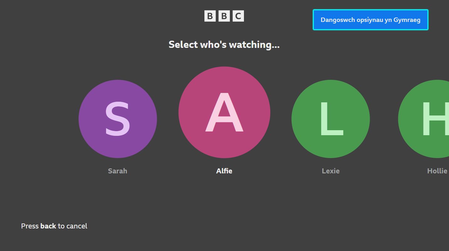 Image of the home screen of the iPlayer TV app. The option to change language to Welsh on the top right is highlighted